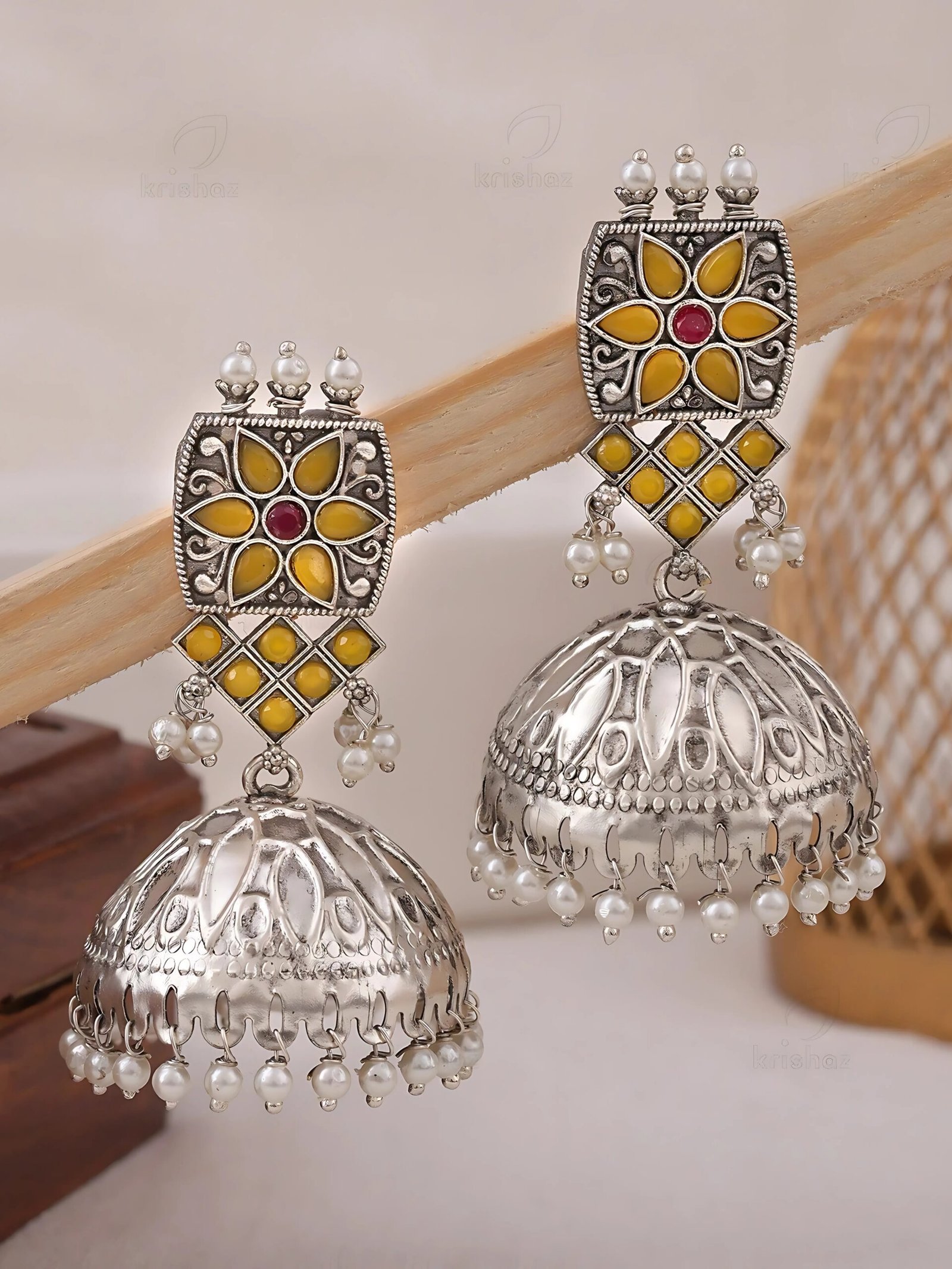 Traditional yellow stone with elegant Jhumks