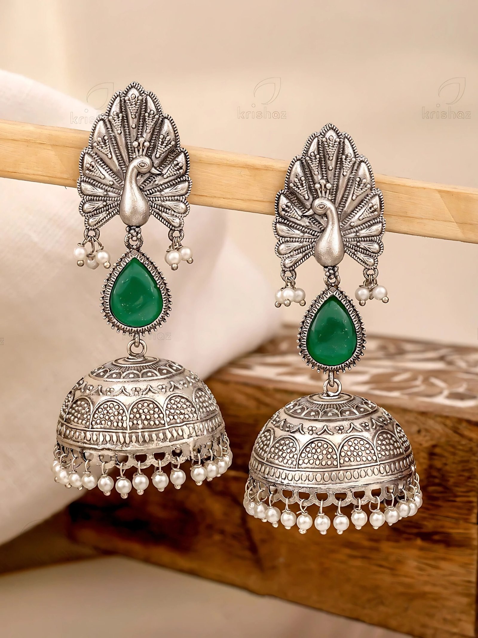 Peacock design with elegant jhumka earring